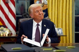 President Donald Trump signs executive orders in the Oval Office